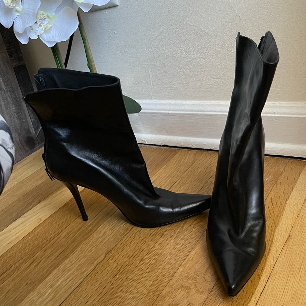 High-heeled boots, black leather